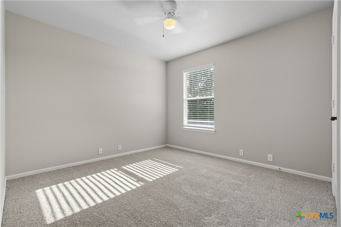 172 Coreopsis Cove Kyle, TX 78640 - Photo 24 of 33 an empty room with windows