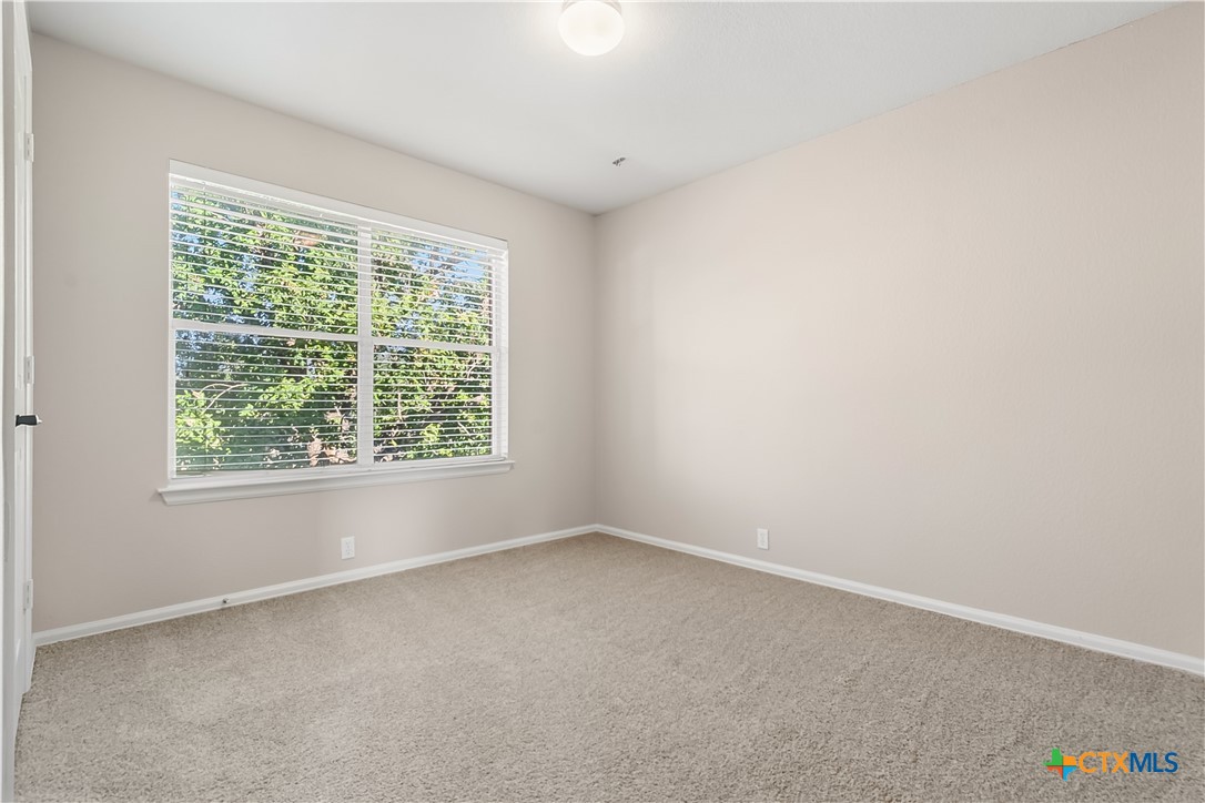 172 Coreopsis Cove Kyle, TX 78640 - Photo 26 of 33 an empty room with a window