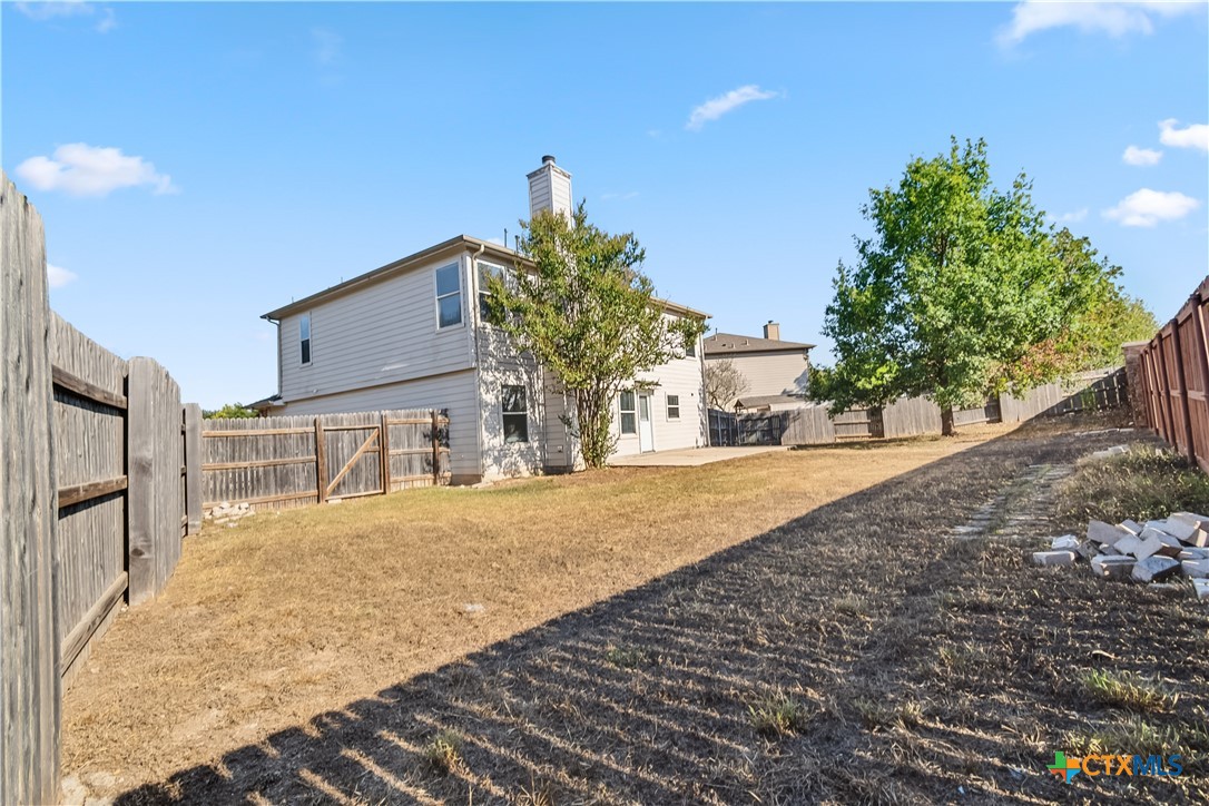 172 Coreopsis Cove Kyle, TX 78640 - Photo 30 of 33 a view of a house with a yard