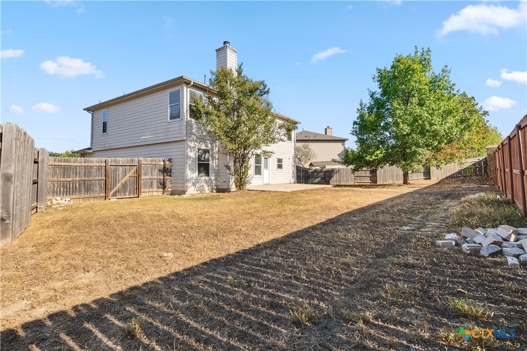 172 Coreopsis Cove Kyle, TX 78640 - Photo 33 of 33 a front view of a house with a yard