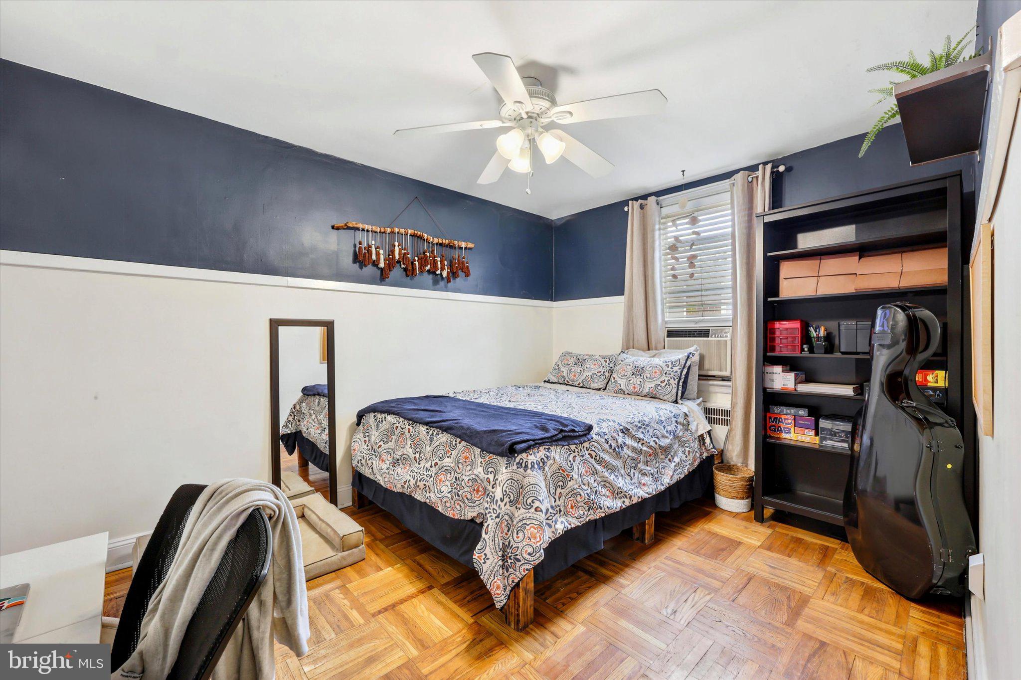 115 Academy Lane Upper Darby, PA 19082 - Photo 17 of 25 a bedroom with a bed and a chandelier