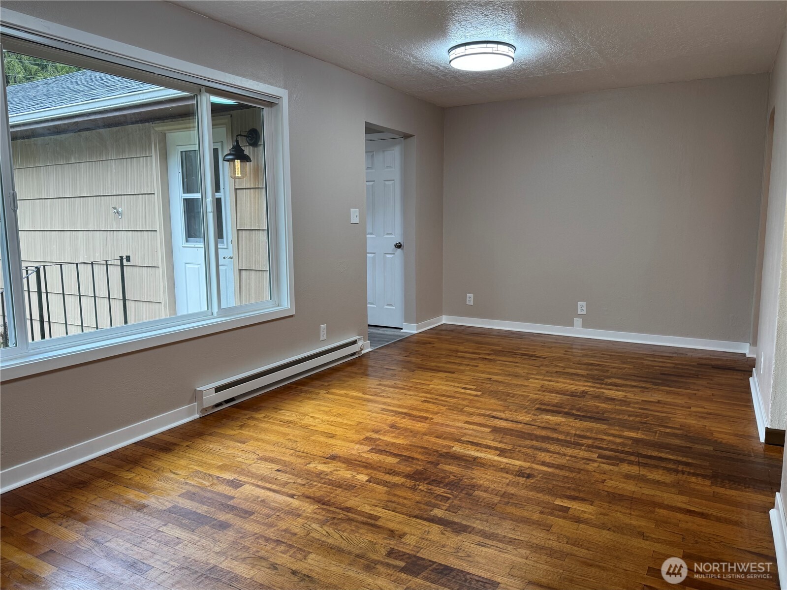 212 McGeary Road Kelso, WA 98626 - Photo 2 of 20 a view of an empty room with window