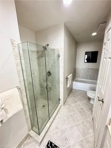 a bathroom with a shower and a sink