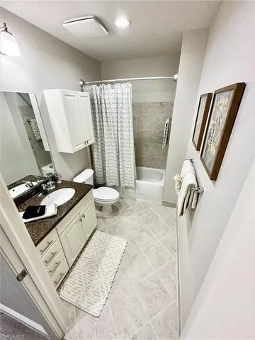 a bathroom with a sink a mirror and tub