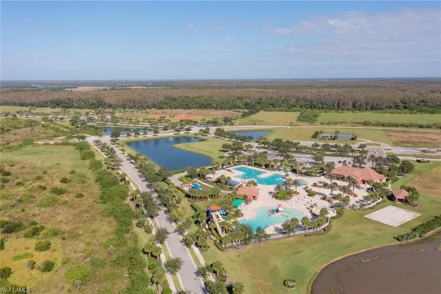 an aerial view of residential building and ocean view