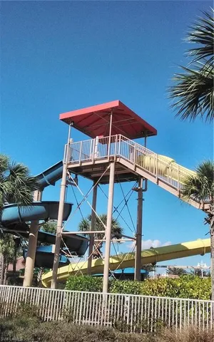 a blue and white umbrella sitting in front of a house