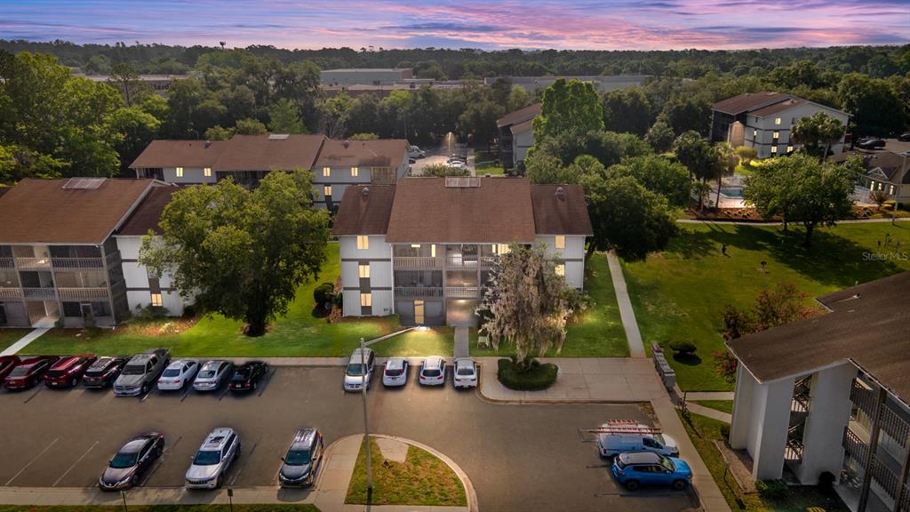 an aerial view of a houses with a swimming pool