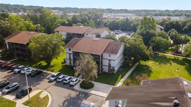 an aerial view of house with yard