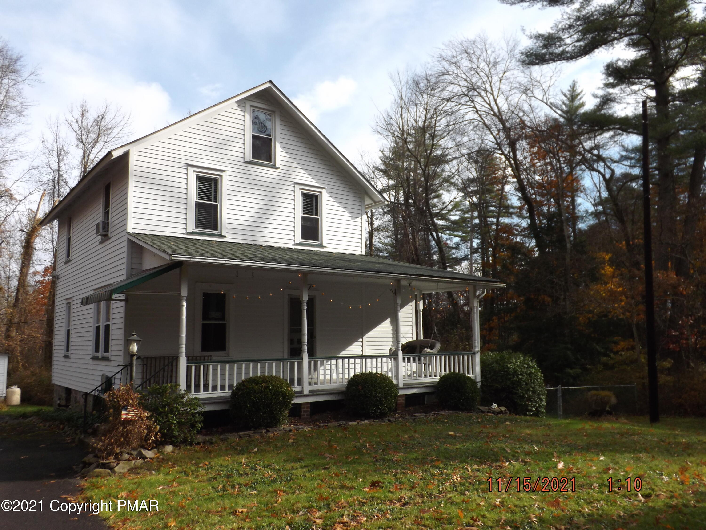 5474 Paradise Valley Road Cresco, PA 18326 - Photo 1 of 34 a front view of a house with a yard