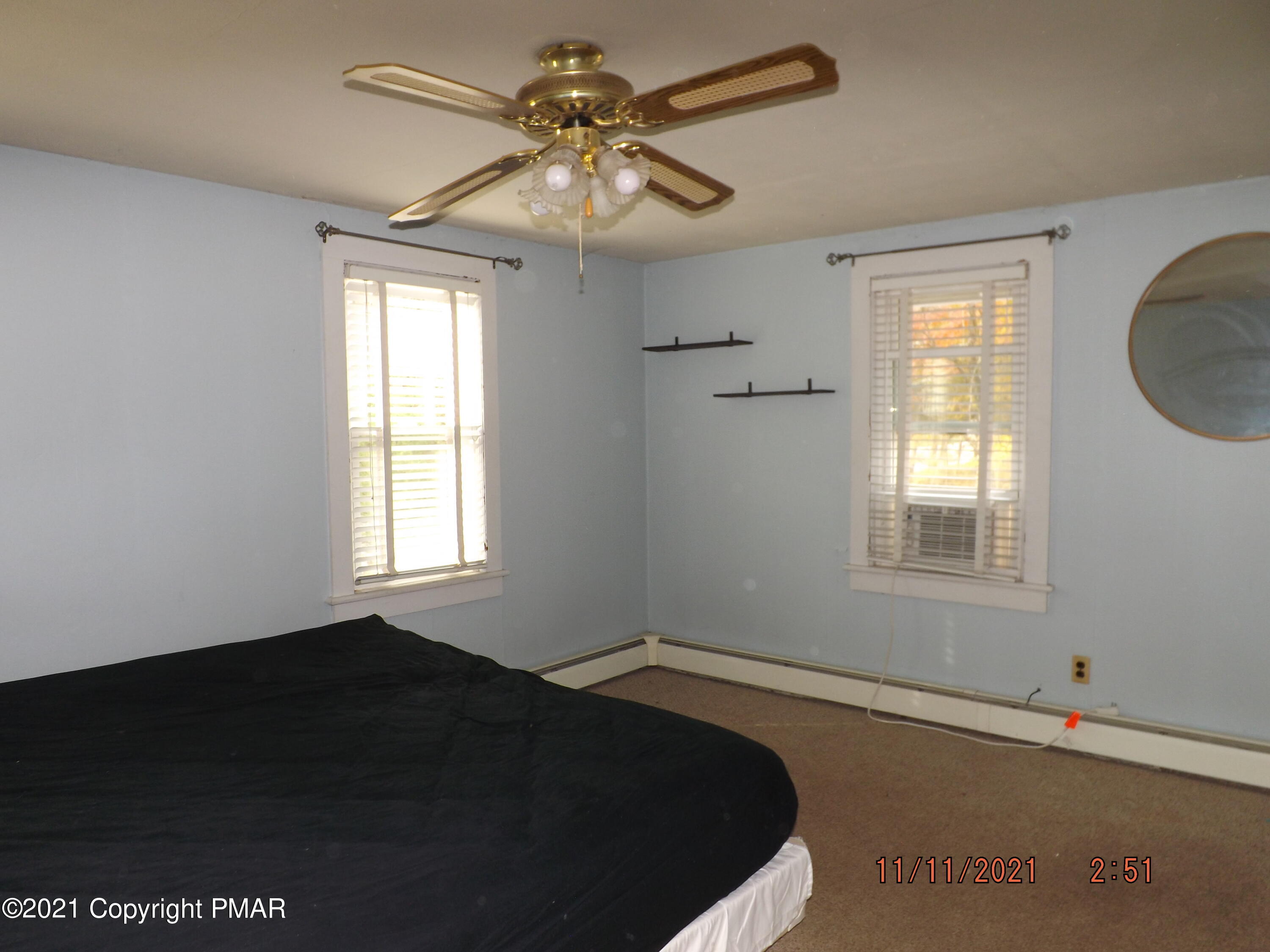 5474 Paradise Valley Road Cresco, PA 18326 - Photo 17 of 34 a view of a livingroom with a ceiling fan and window