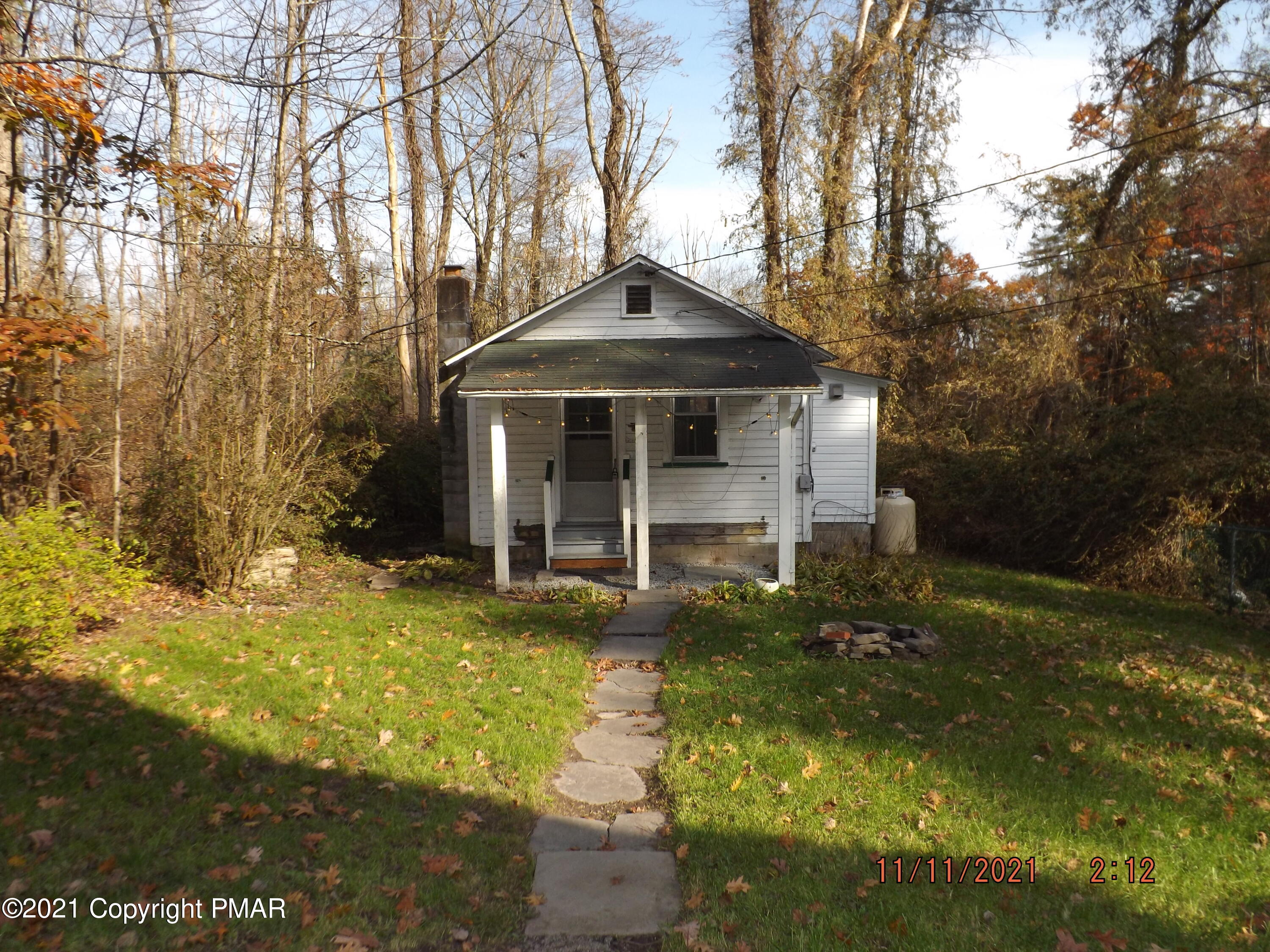 5474 Paradise Valley Road Cresco, PA 18326 - Photo 23 of 34 a front view of a house with yard
