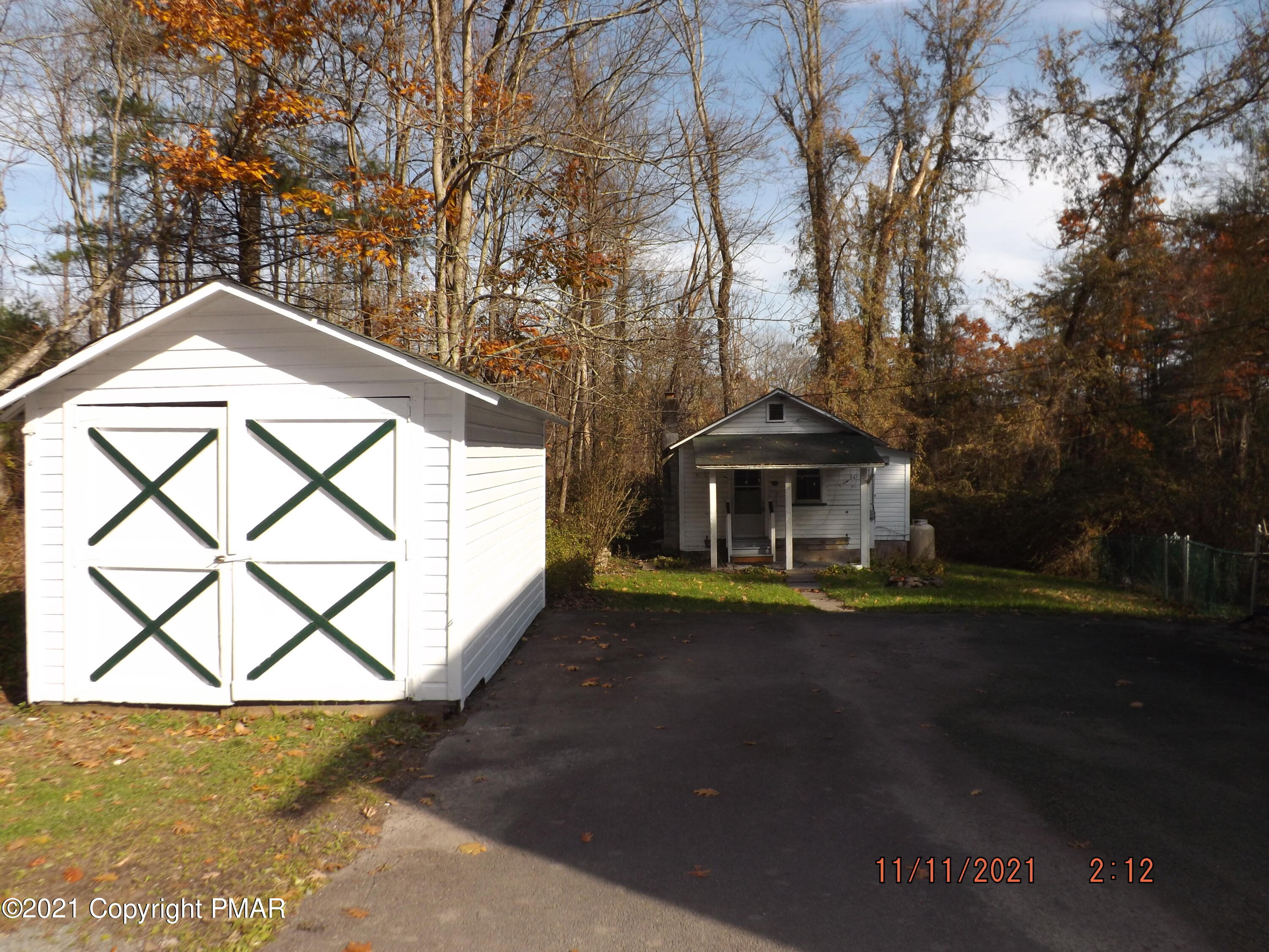 5474 Paradise Valley Road Cresco, PA 18326 - Photo 24 of 34 a front view of a house with a yard