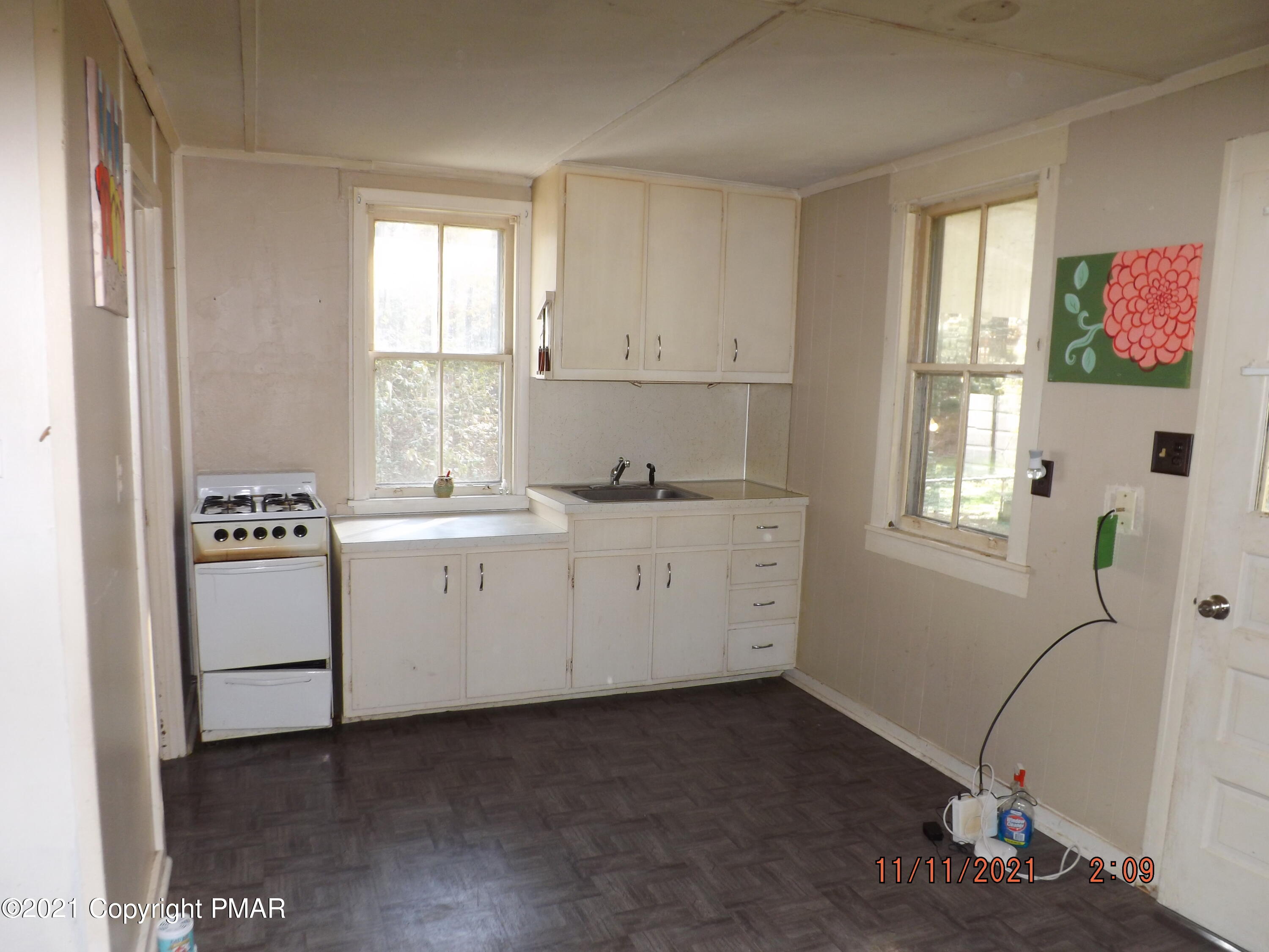5474 Paradise Valley Road Cresco, PA 18326 - Photo 26 of 34 a utility room with cabinets washer and dryer