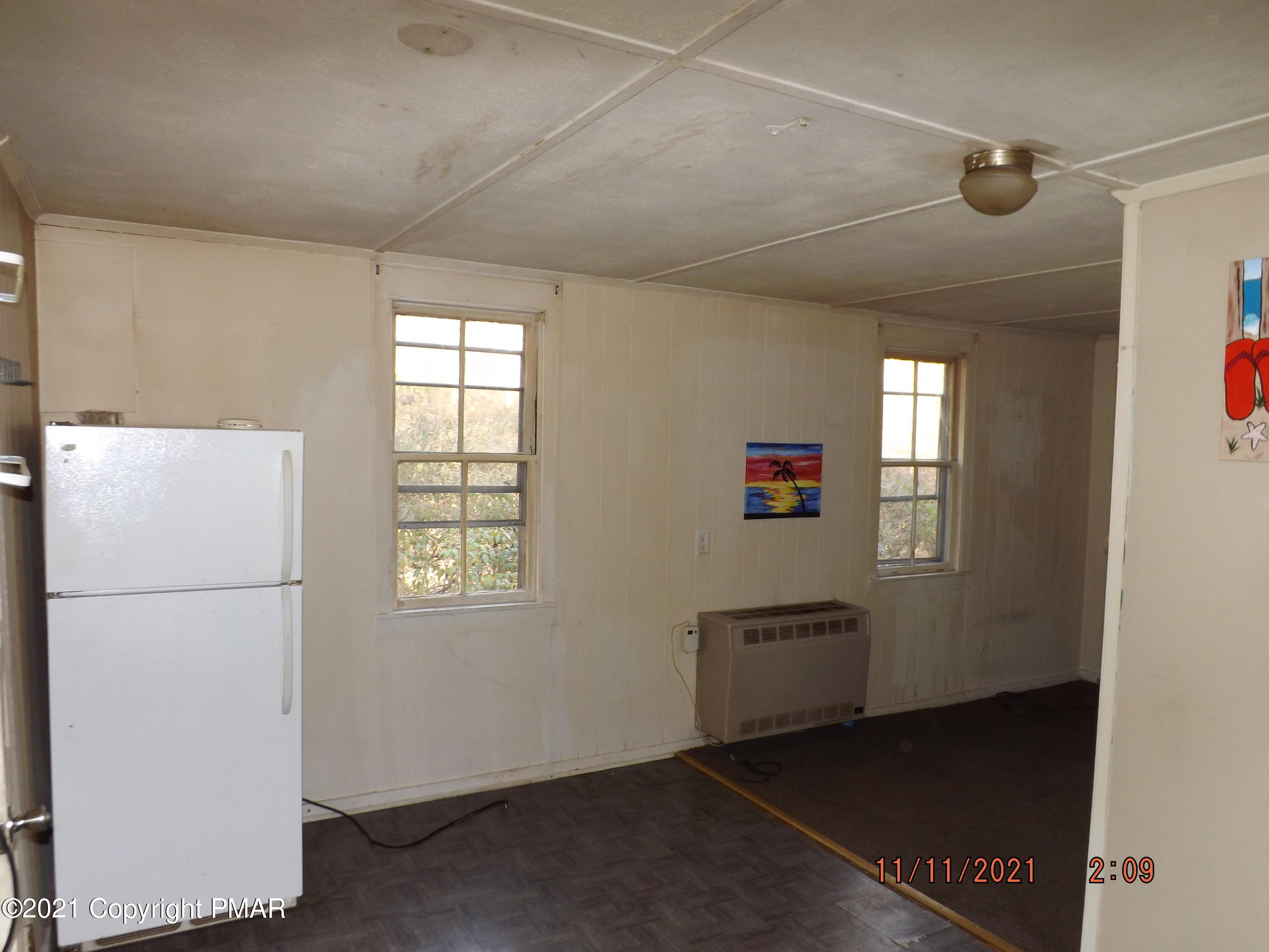 5474 Paradise Valley Road Cresco, PA 18326 - Photo 27 of 34 a view of a hallway with kitchen and entryway