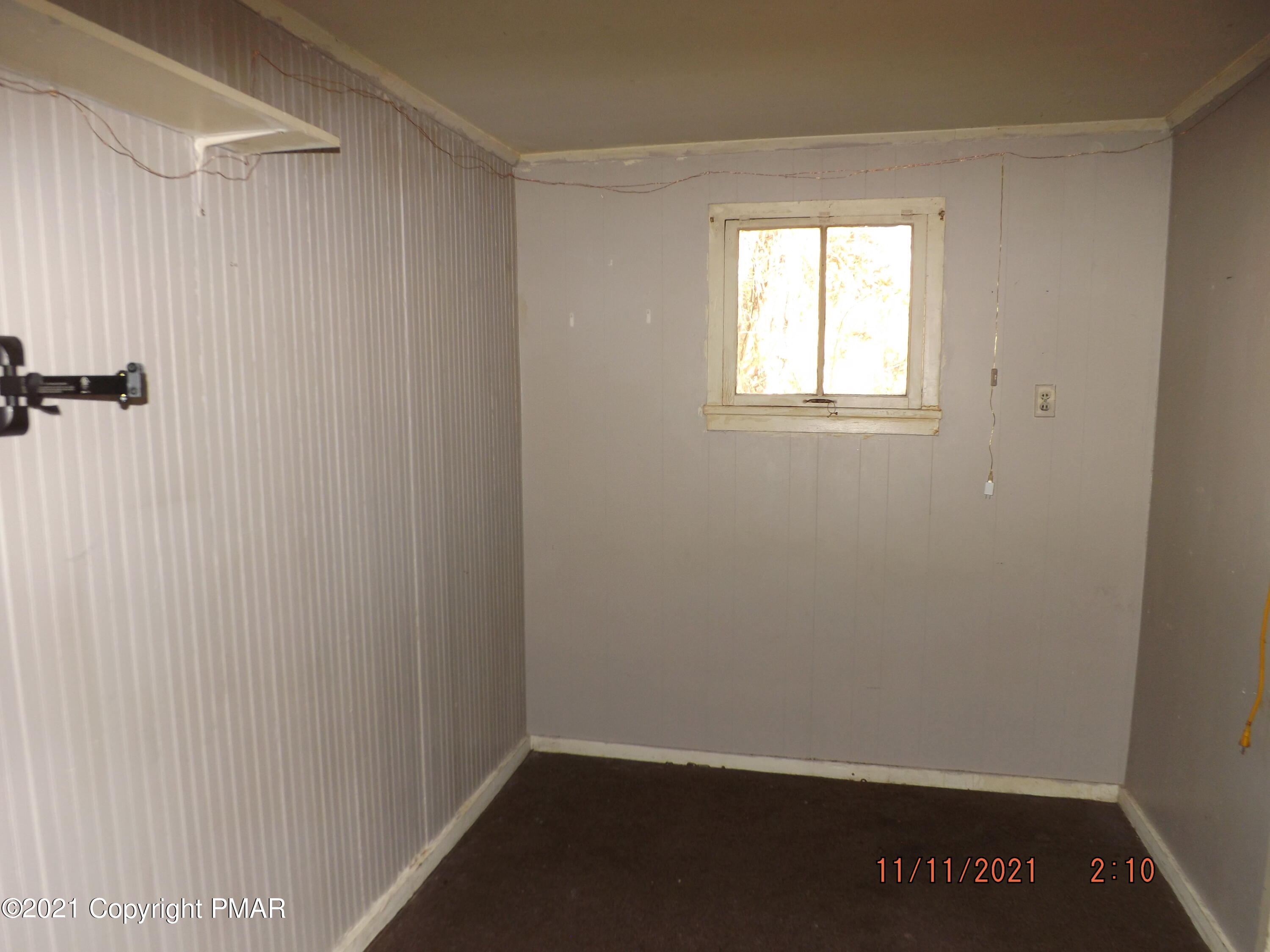 5474 Paradise Valley Road Cresco, PA 18326 - Photo 30 of 34 a view of a small space with wooden floor and a window
