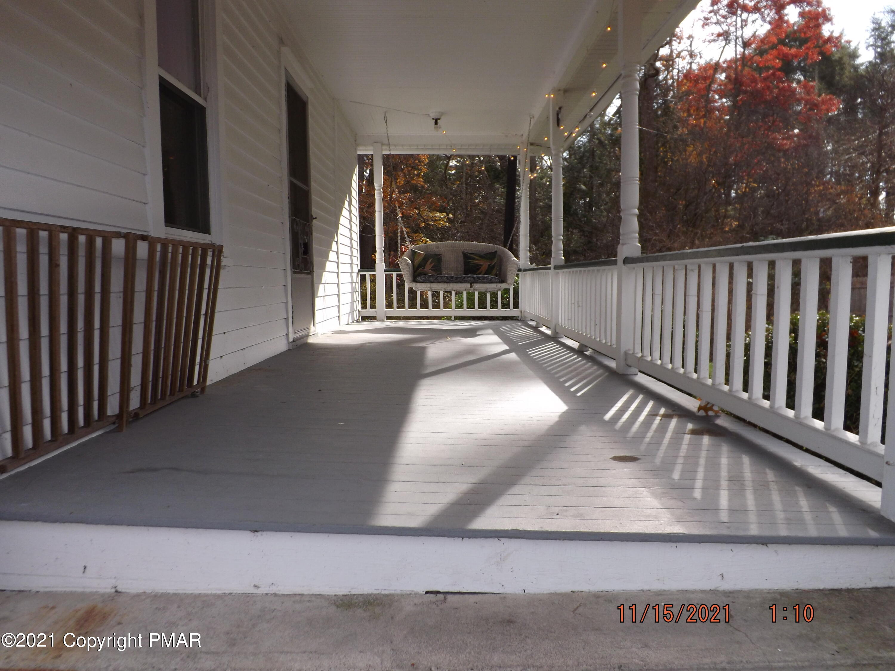 5474 Paradise Valley Road Cresco, PA 18326 - Photo 3 of 34 a view of staircase with railing and a rug