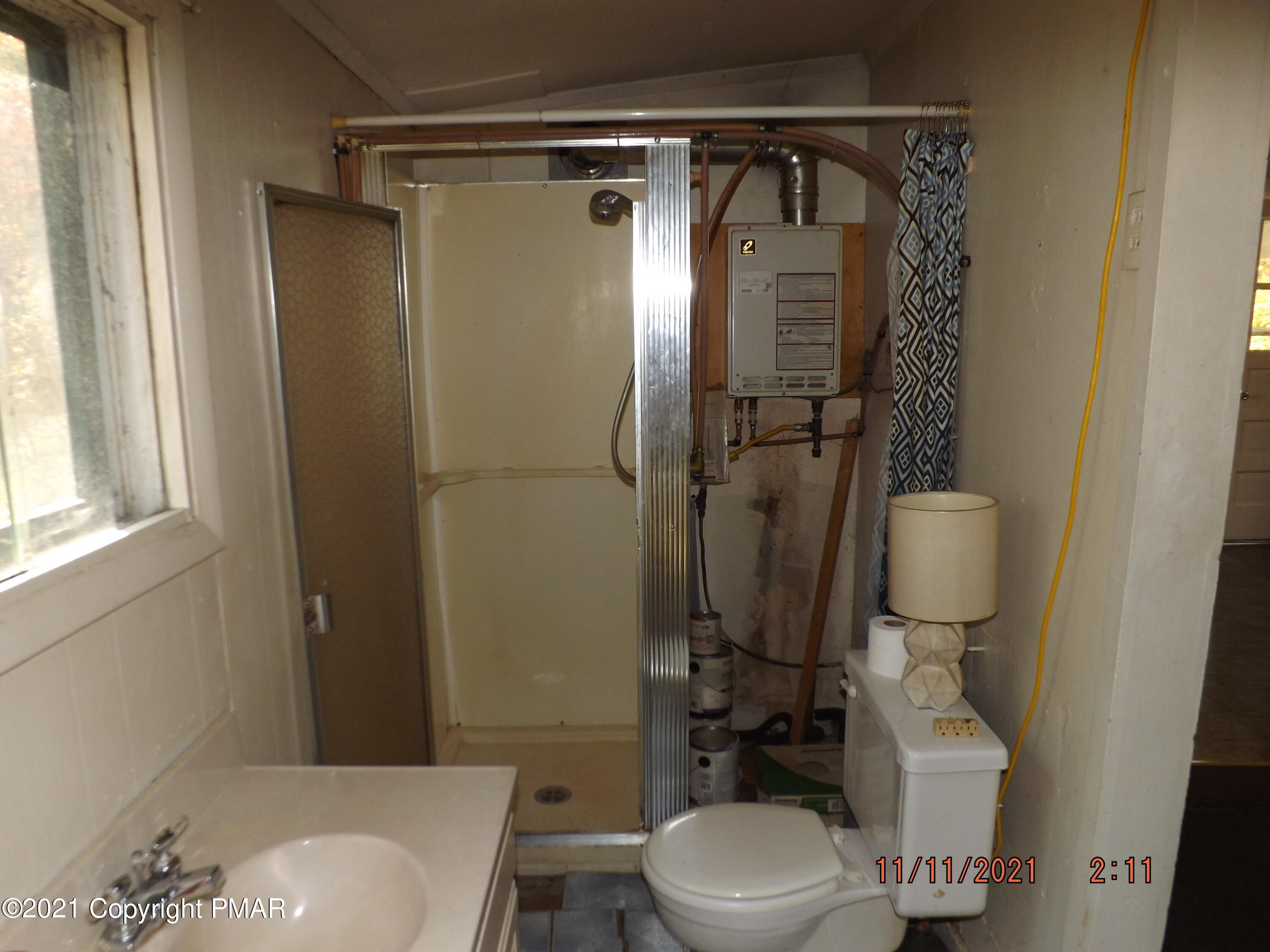 5474 Paradise Valley Road Cresco, PA 18326 - Photo 31 of 34 a bathroom with a toilet sink and tub