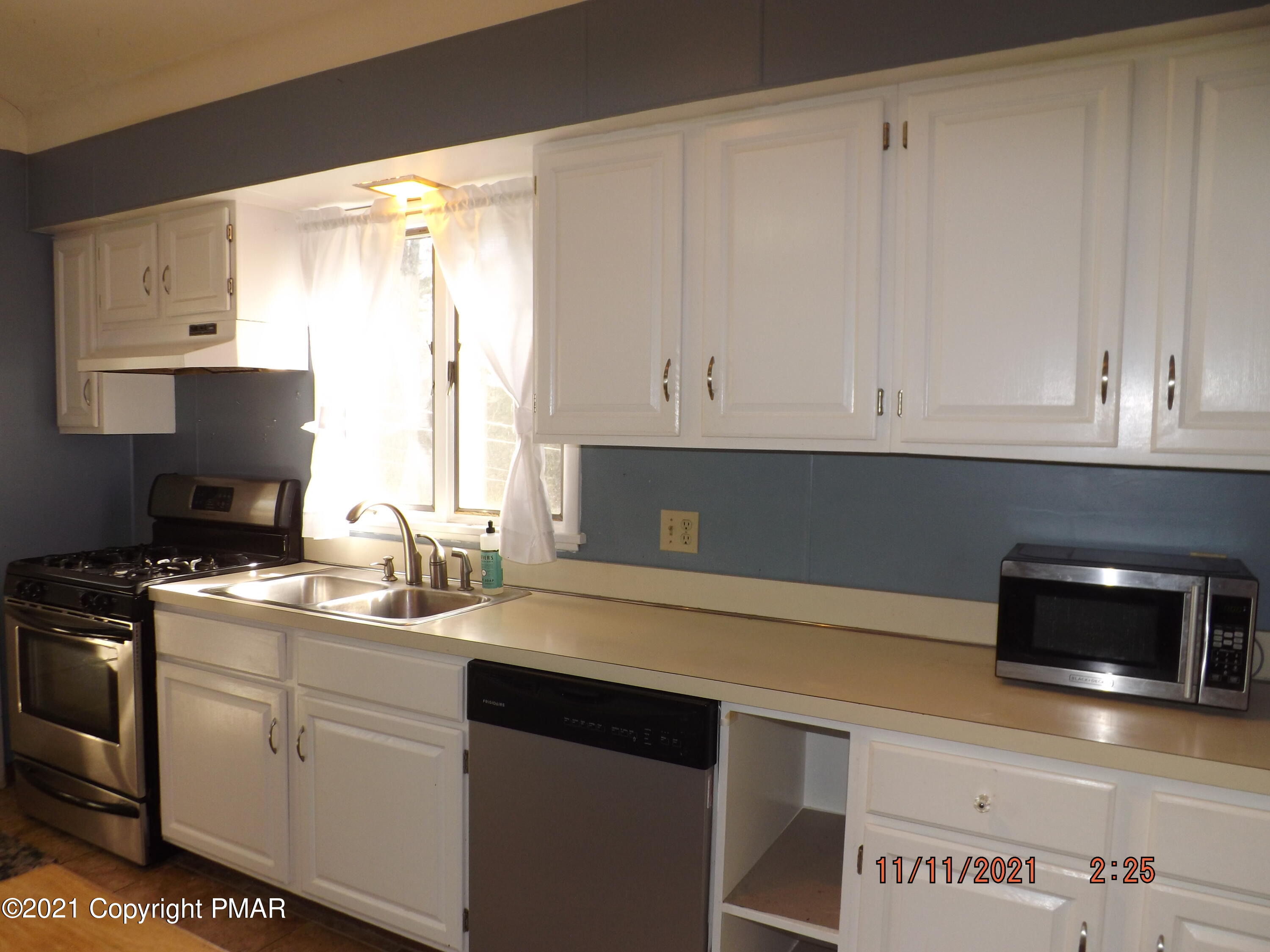 5474 Paradise Valley Road Cresco, PA 18326 - Photo 6 of 34 a kitchen with appliances cabinets and a sink