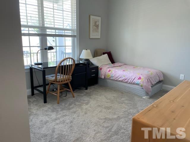 1425 Barn Door Drive Apex, NC 27502 - Photo 17 of 43 a bedroom with a bed chair and a window