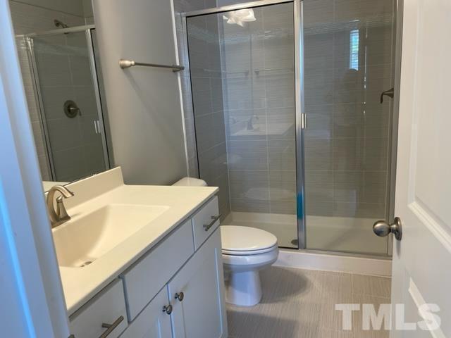 1425 Barn Door Drive Apex, NC 27502 - Photo 18 of 43 a bathroom with a sink and toilet