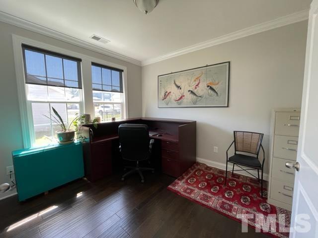 1425 Barn Door Drive Apex, NC 27502 - Photo 20 of 43 a view of a workspace with furniture and a window