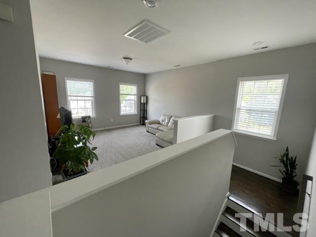 1425 Barn Door Drive Apex, NC 27502 - Photo 24 of 43 a room with a potted plant on the counter and a window