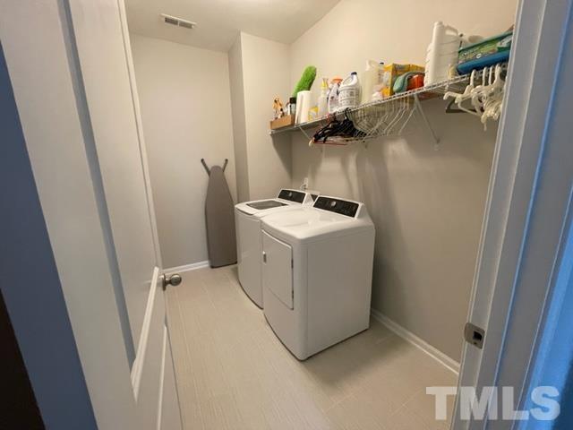 1425 Barn Door Drive Apex, NC 27502 - Photo 26 of 43 a utility room with dryer and washer