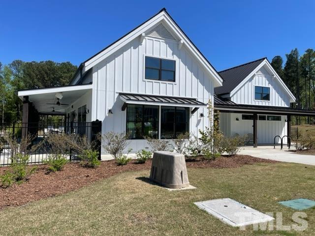 1425 Barn Door Drive Apex, NC 27502 - Photo 40 of 43 a front view of a house with a yard outdoor seating and entertaining space