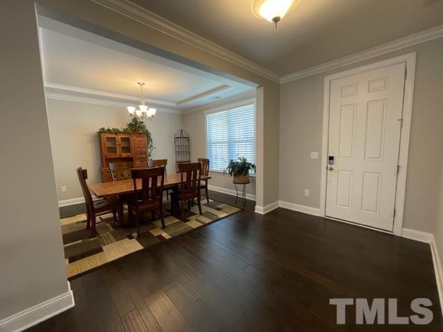 1425 Barn Door Drive Apex, NC 27502 - Photo 5 of 43 a view of a dining room with furniture and wooden floor