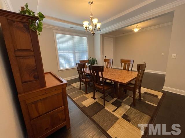 1425 Barn Door Drive Apex, NC 27502 - Photo 7 of 43 a view of a dining room with furniture and window