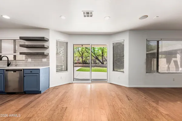 a view of a kitchen with a sink and a window