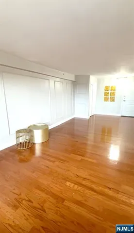 a view of kitchen and dining room with furniture and chandelier