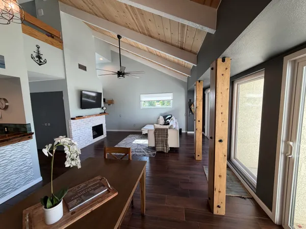 a living room with furniture fireplace and flat screen tv