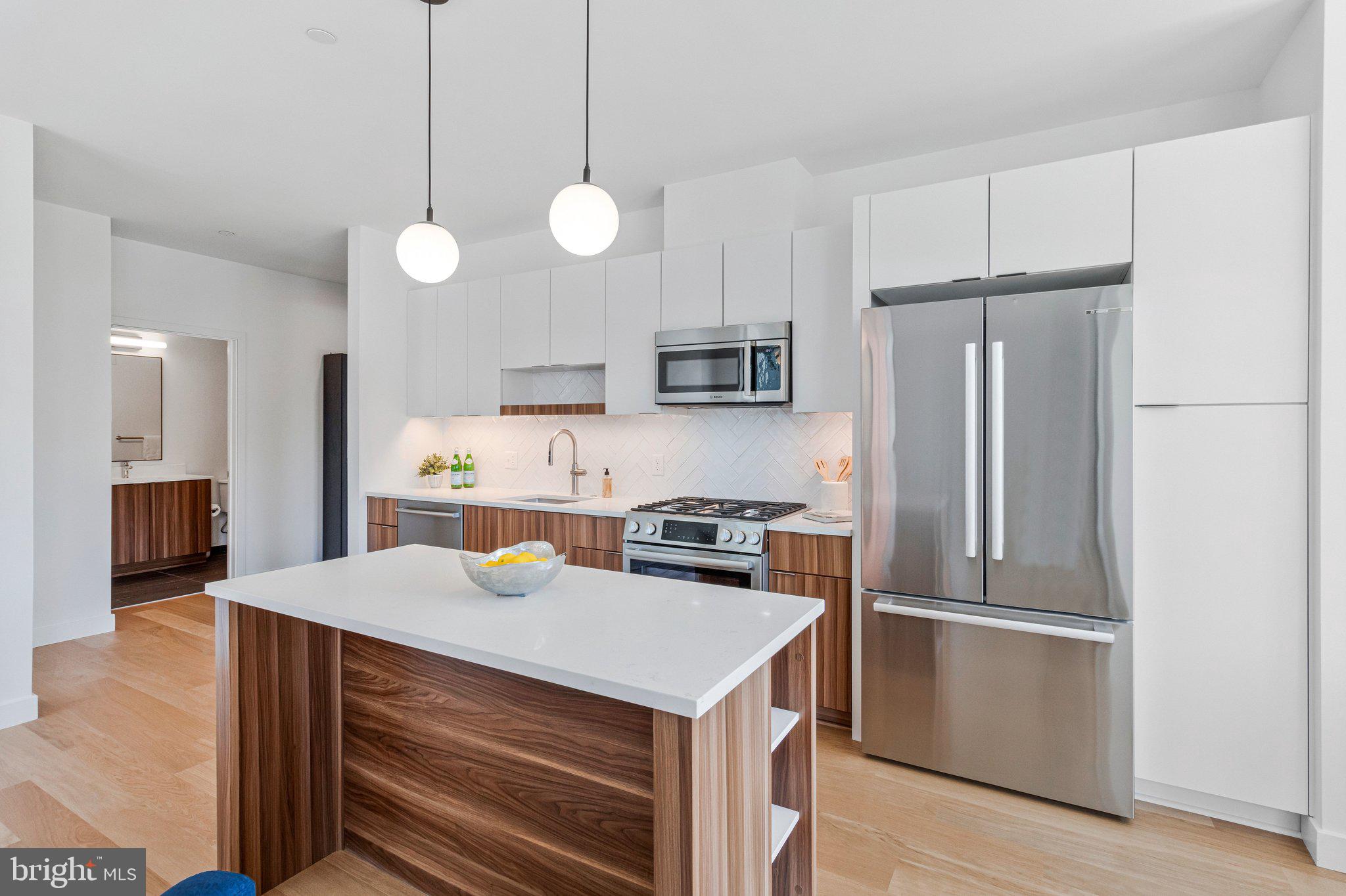 7175 12th Street Northwest, Unit 302 Washington, DC 20012 - Photo 4 of 60 Gourmet kitchen with breakfast bar