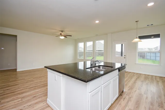 a kitchen with sink and window
