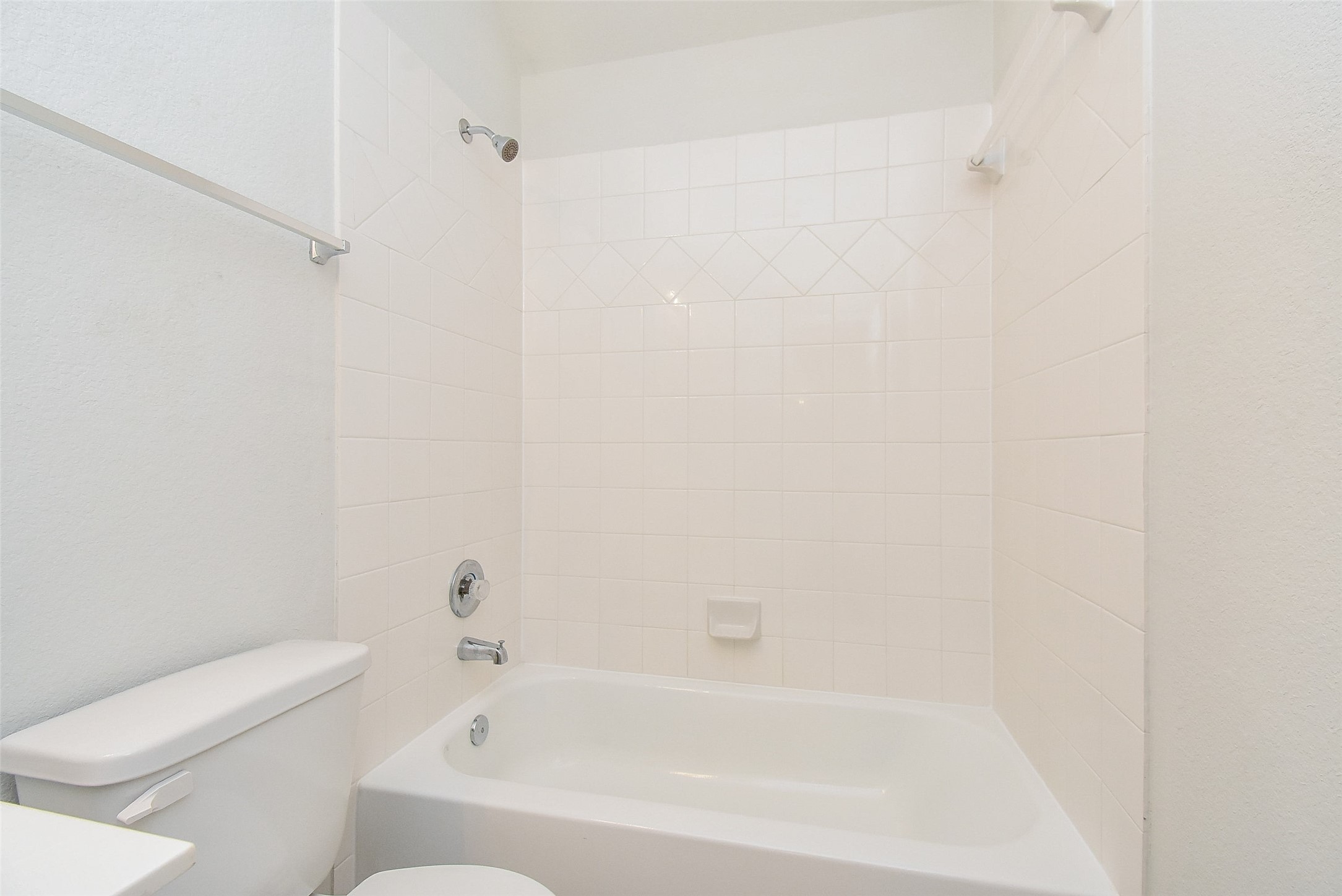 32426 Fly Fish Way Fulshear, TX 77441 - Photo 25 of 32 a bathroom with a bathtub and a toilet