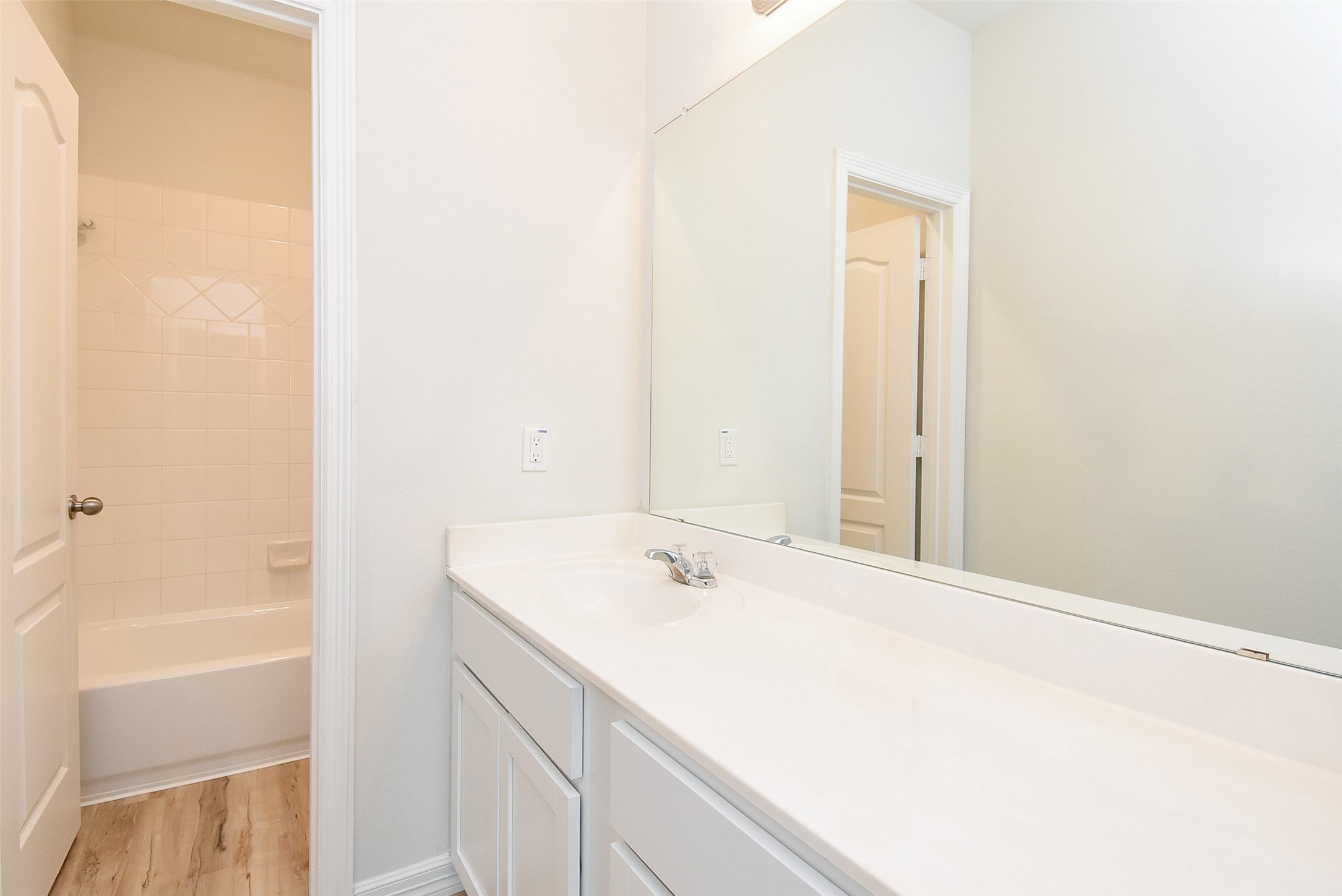 32426 Fly Fish Way Fulshear, TX 77441 - Photo 26 of 32 a bathroom with a sink and a mirror