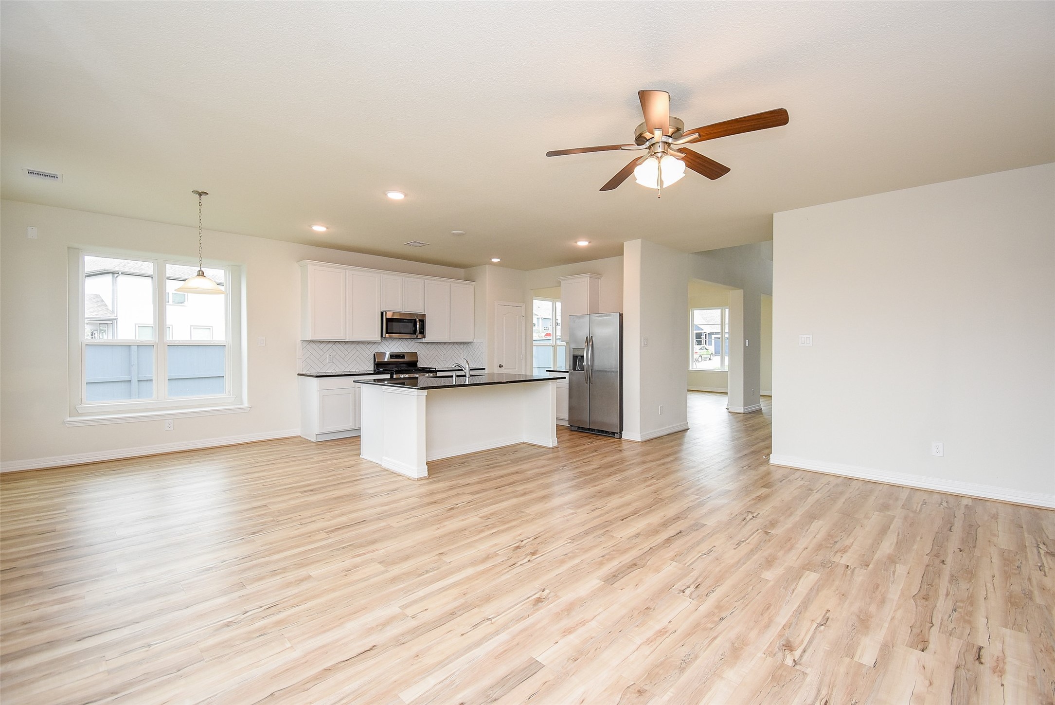 32426 Fly Fish Way Fulshear, TX 77441 - Photo 9 of 32 a view of kitchen with refrigerator and window