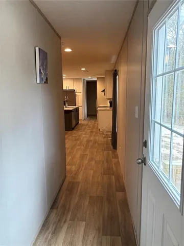 a view of a living room with a wooden floor