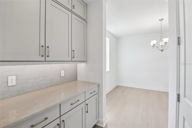 a kitchen with a sink and a refrigerator