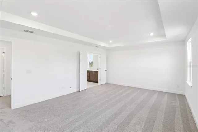 a bathroom with double vanity sinks and a mirror