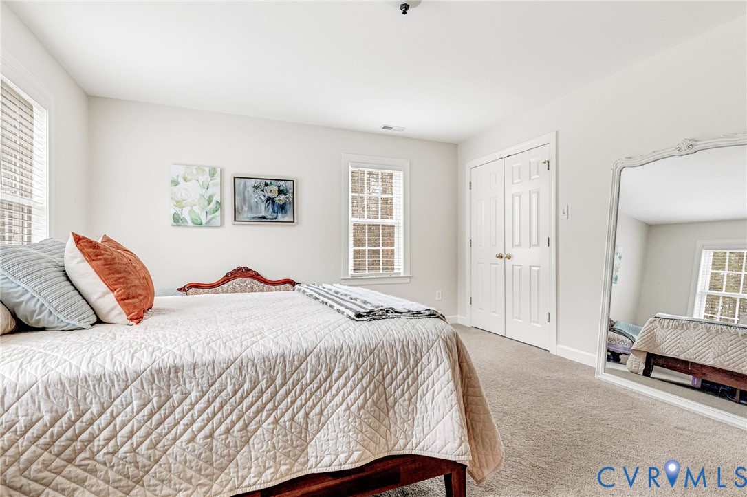 14436 Overlook Ridge Lane Beaverdam, VA 23015 - Photo 36 of 82 a bedroom with a bed and a couch