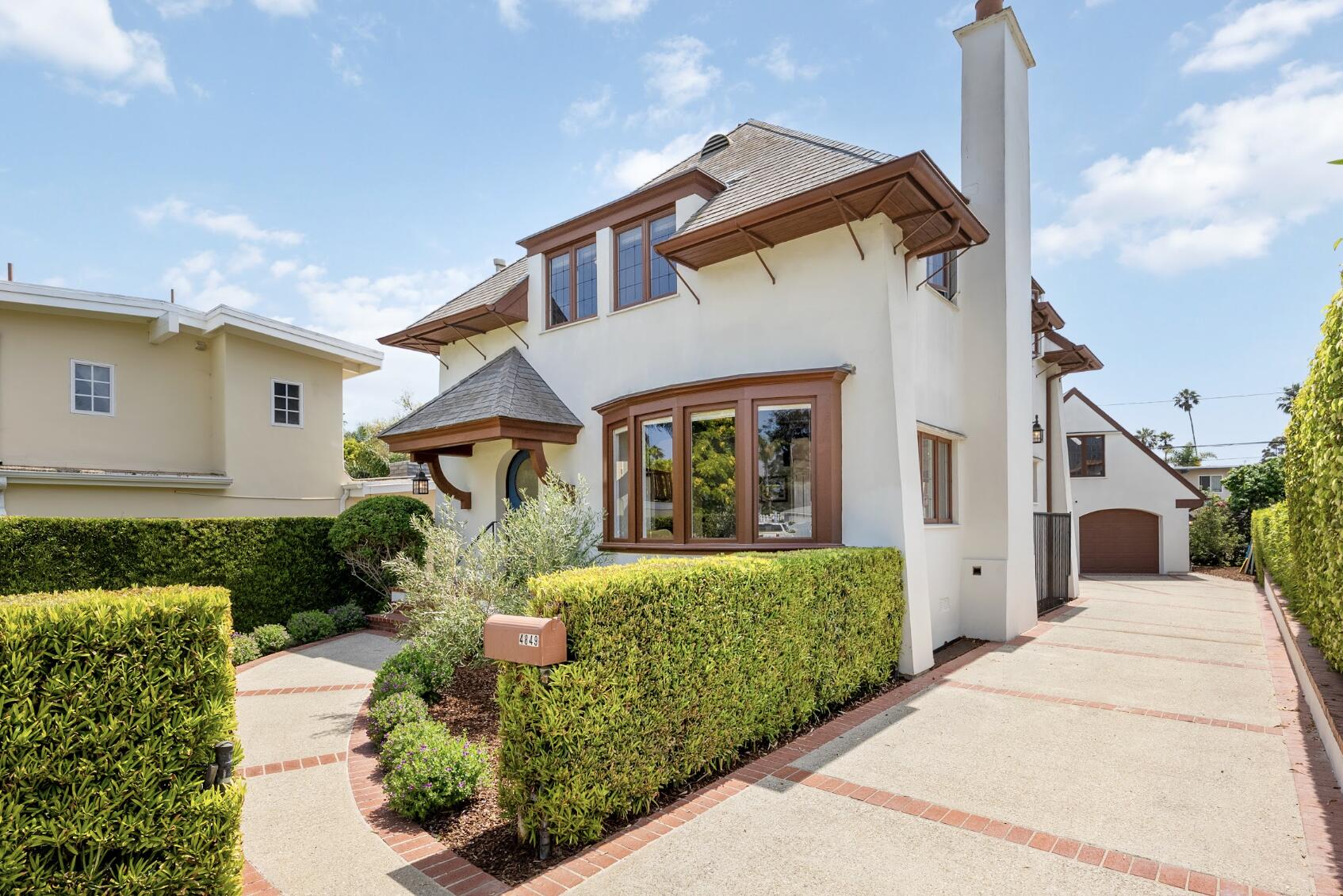 4849 3rd Street Carpinteria, CA 93013 - Photo 1 of 1 a front view of a house with garden