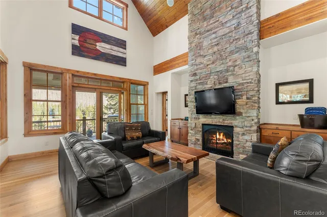 a living room with fireplace furniture and a flat screen tv