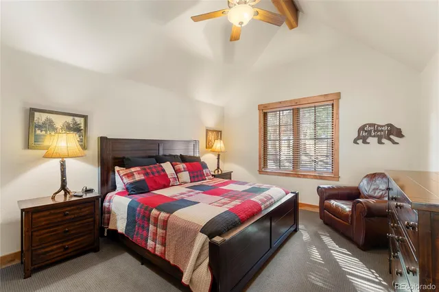 a bathroom with a granite countertop shower and a sink
