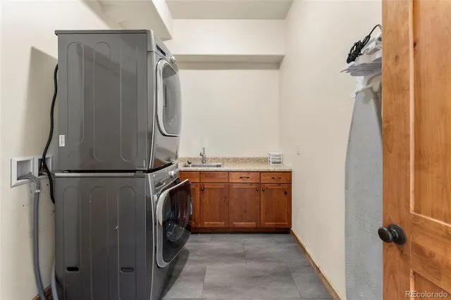 a room with furniture pool table wooden floor and windows