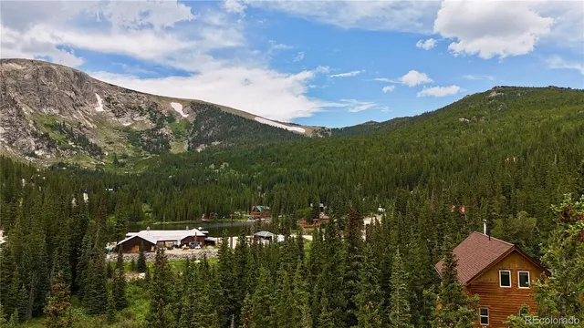 a view of a town with mountains in the background