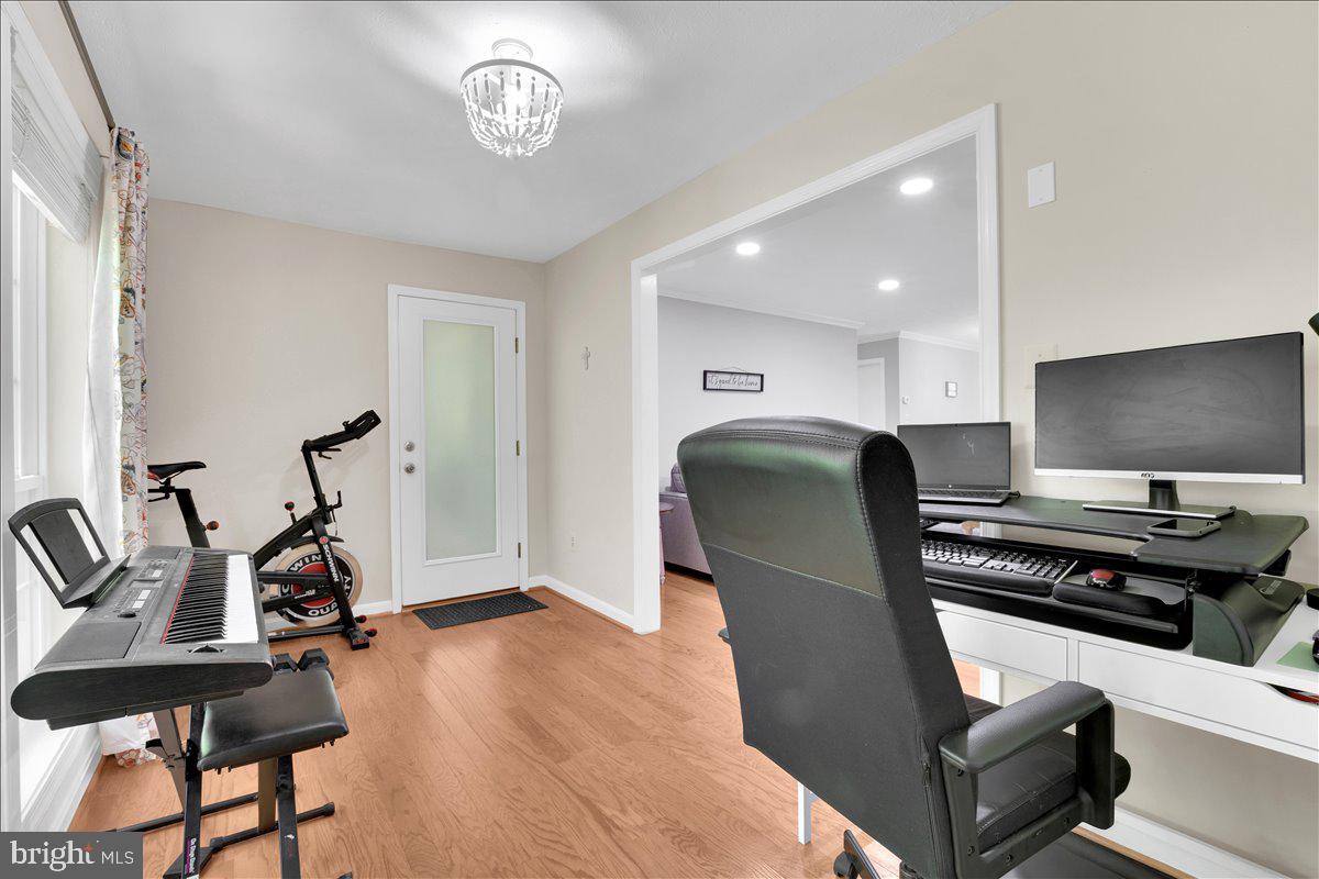 10096 Oakton Terrace Road, Unit 10096 Oakton, VA 22124 - Photo 15 of 24 a view of a workspace with furniture and a window