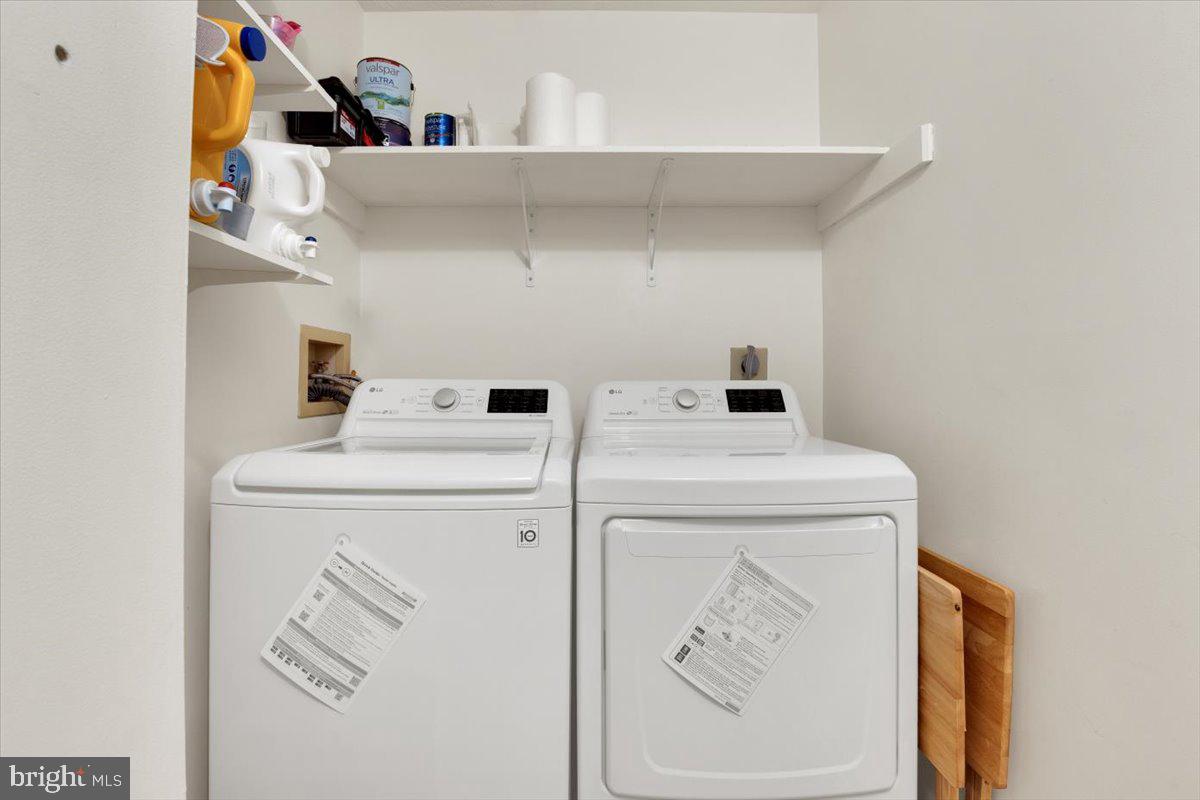 10096 Oakton Terrace Road, Unit 10096 Oakton, VA 22124 - Photo 23 of 24 a utility room with dryer and washer