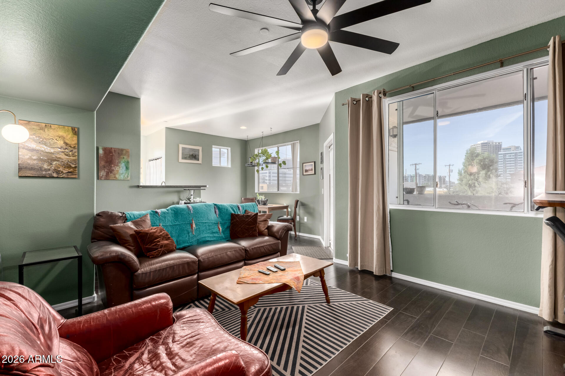 3302 North 7th Street, Unit 232 Phoenix, AZ 85014 - Photo 1 of 47 a living room with furniture and a large window
